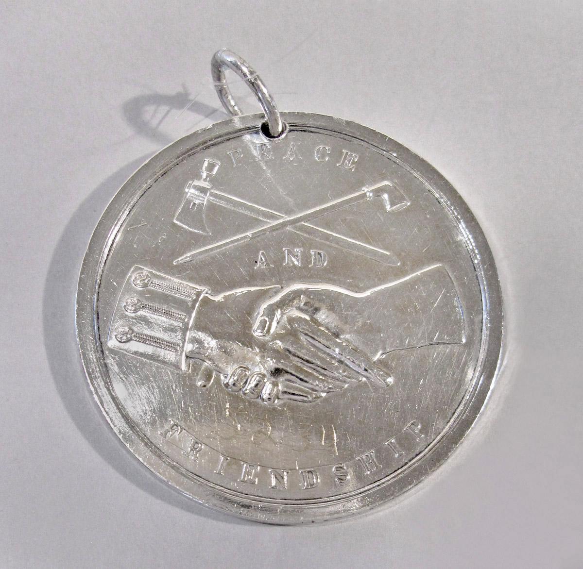 1952.0034 Medal, reverse