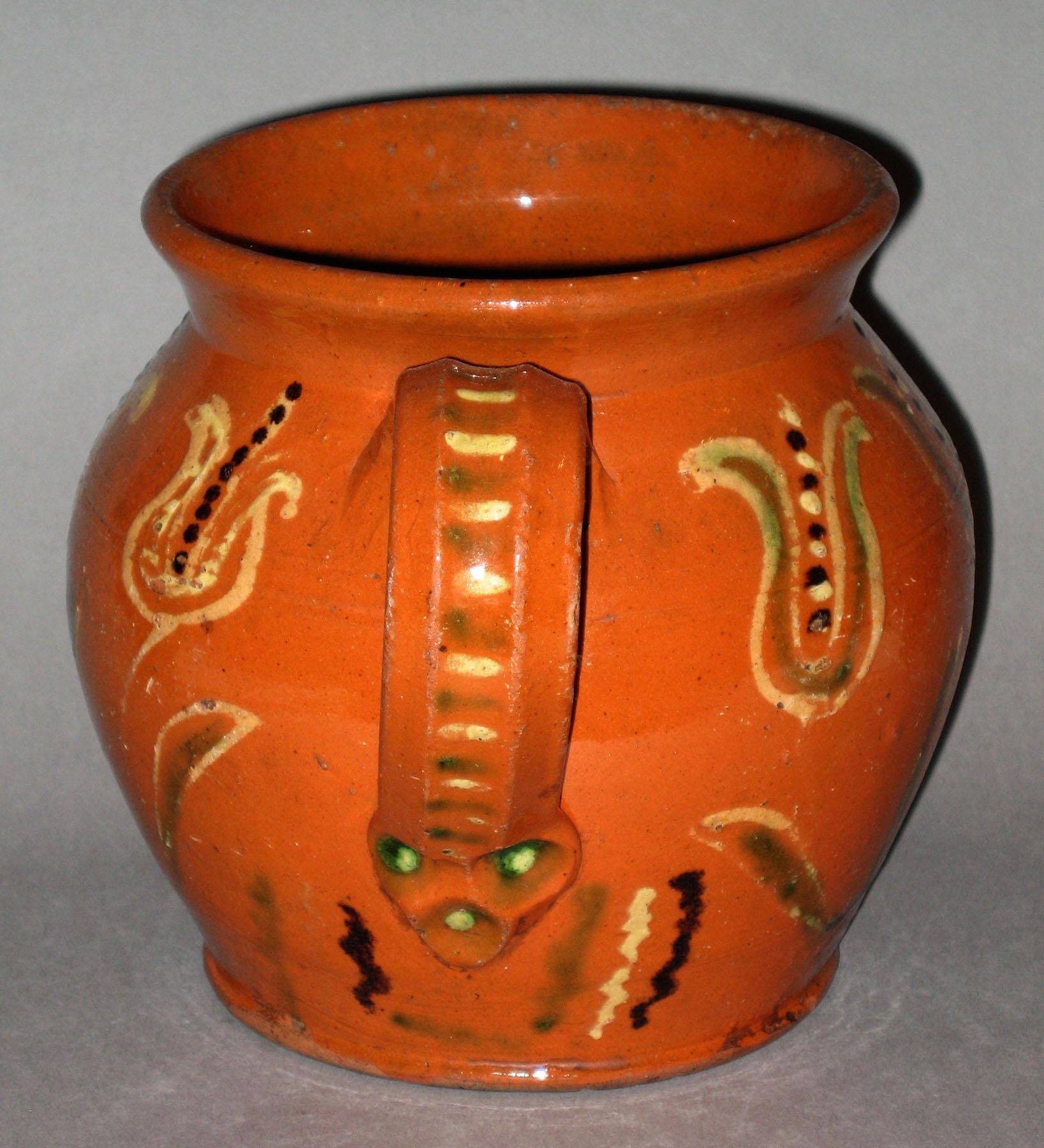 1960.0617 Slipware jug or cooking pot (handle view)