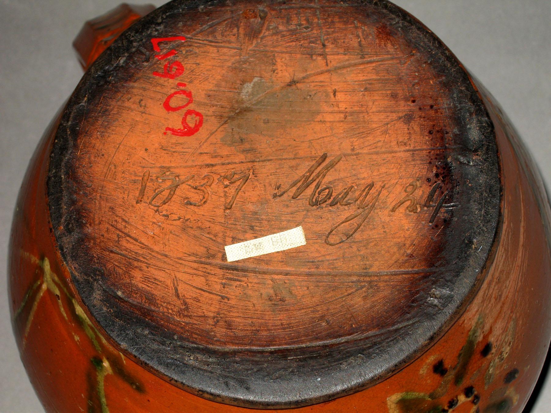 1960.0617 Slipware jug or cooking pot (bottom)