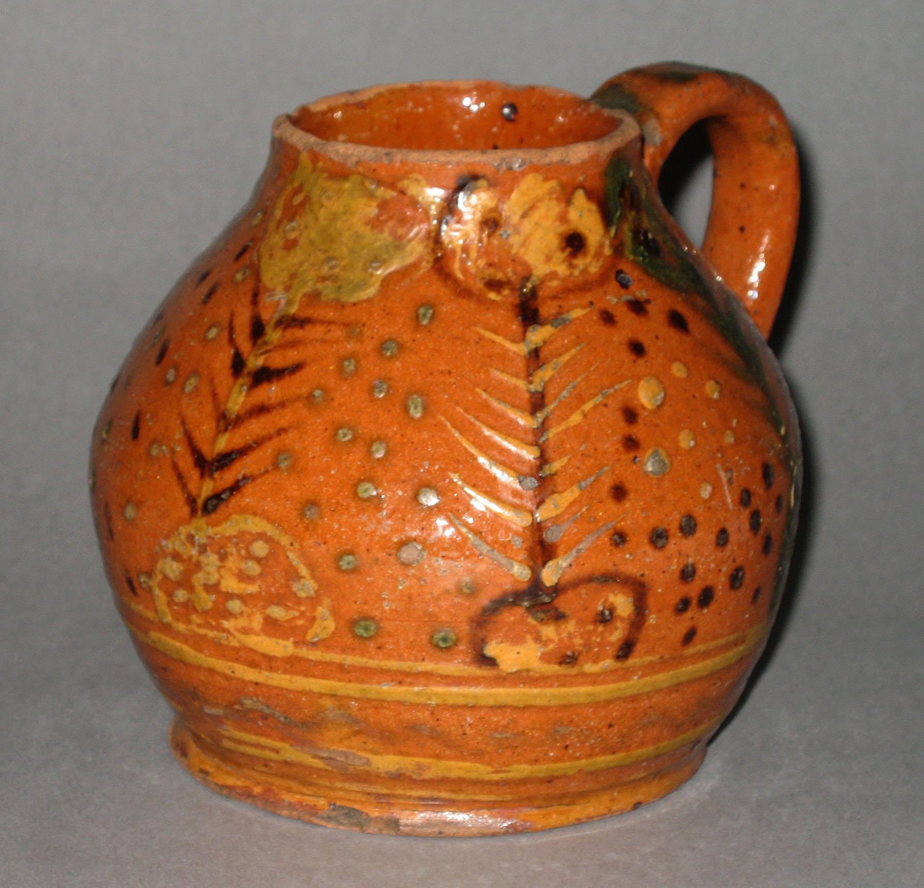 1960.0635 Trailed slipware bottle or jug