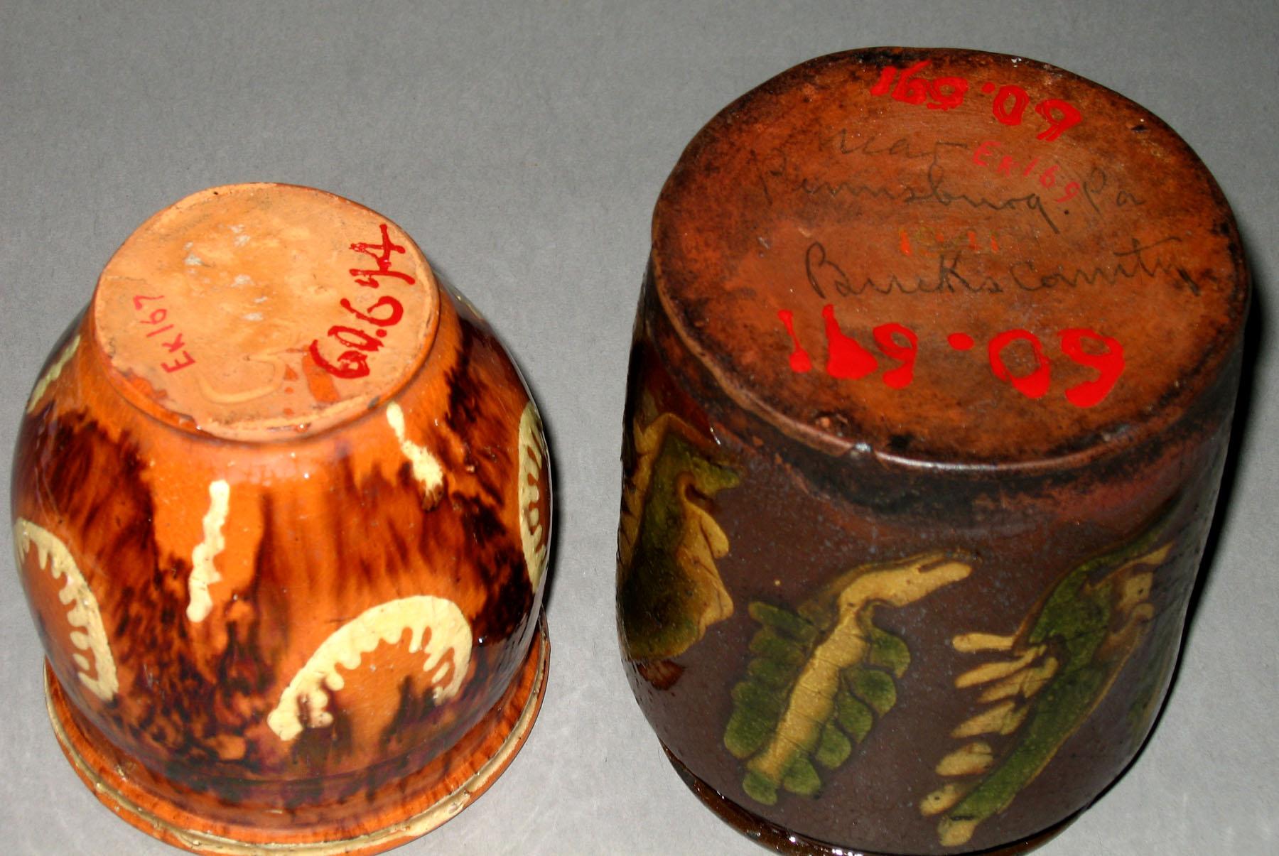 1960.0694; 1960.0691 Slip-trailed redware jars (bottoms)