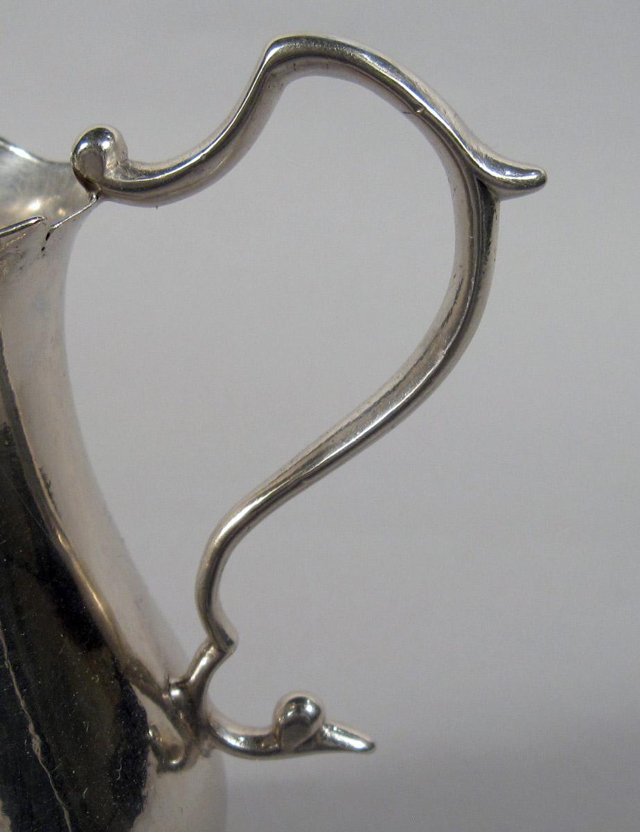 1960.1046 Silver Milk Pot handle detail