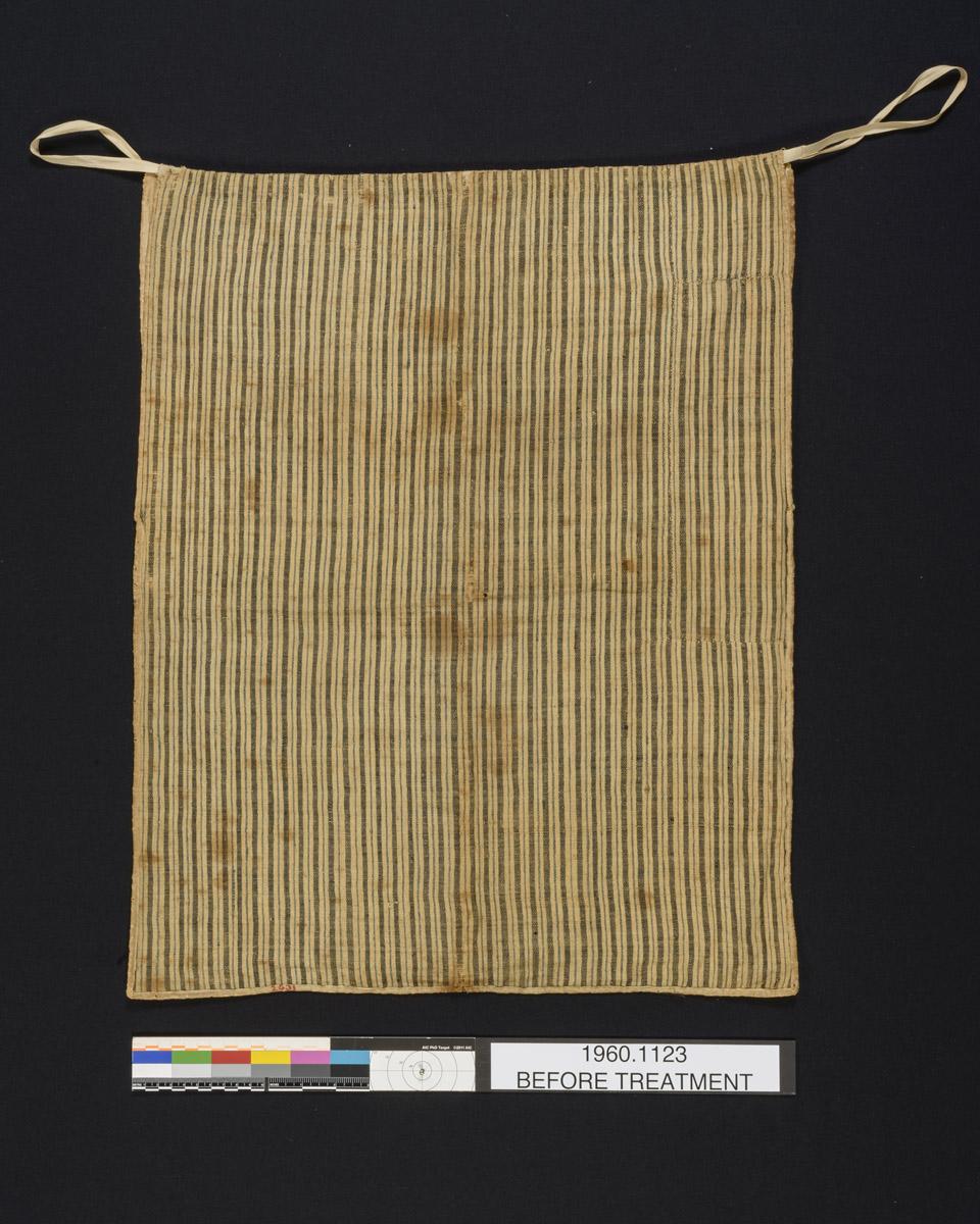 1960.1123 Bag, reverse, before conservation treatment
