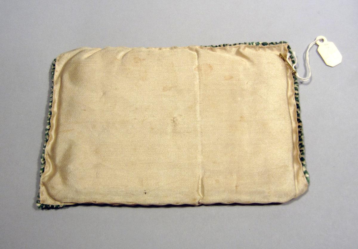 1960.1144 C Sewing box pillow underside
