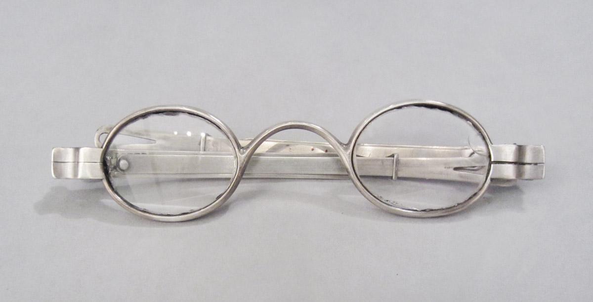 1961.0075 A Spectacles, upper surface