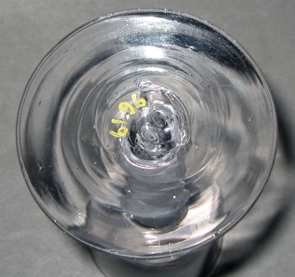 1961.0096 Colorless glass wine glass (underside)