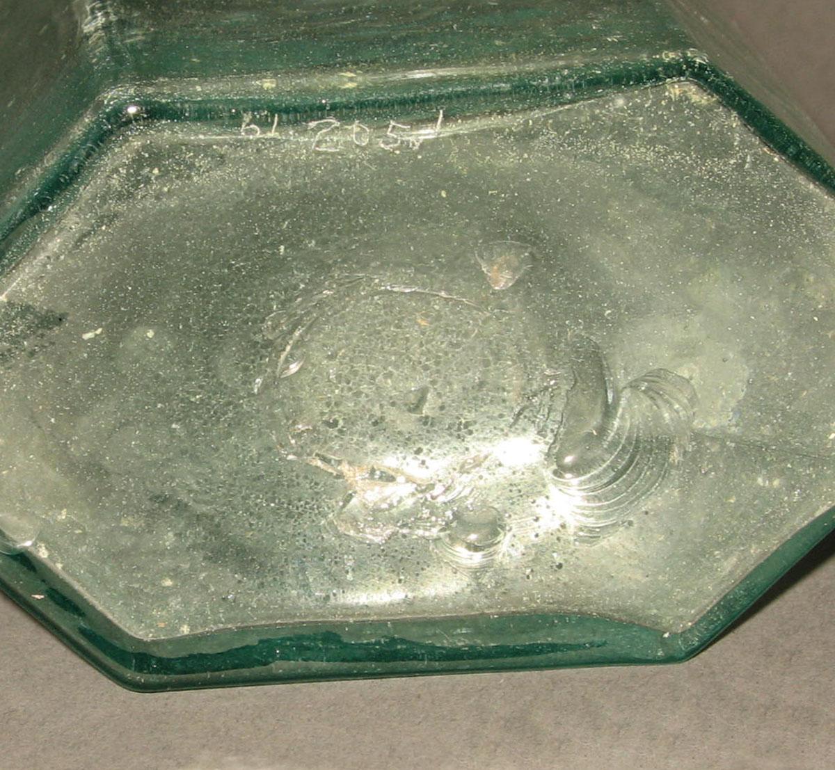 1961.0205.001 Glass syrup bottle (underside)