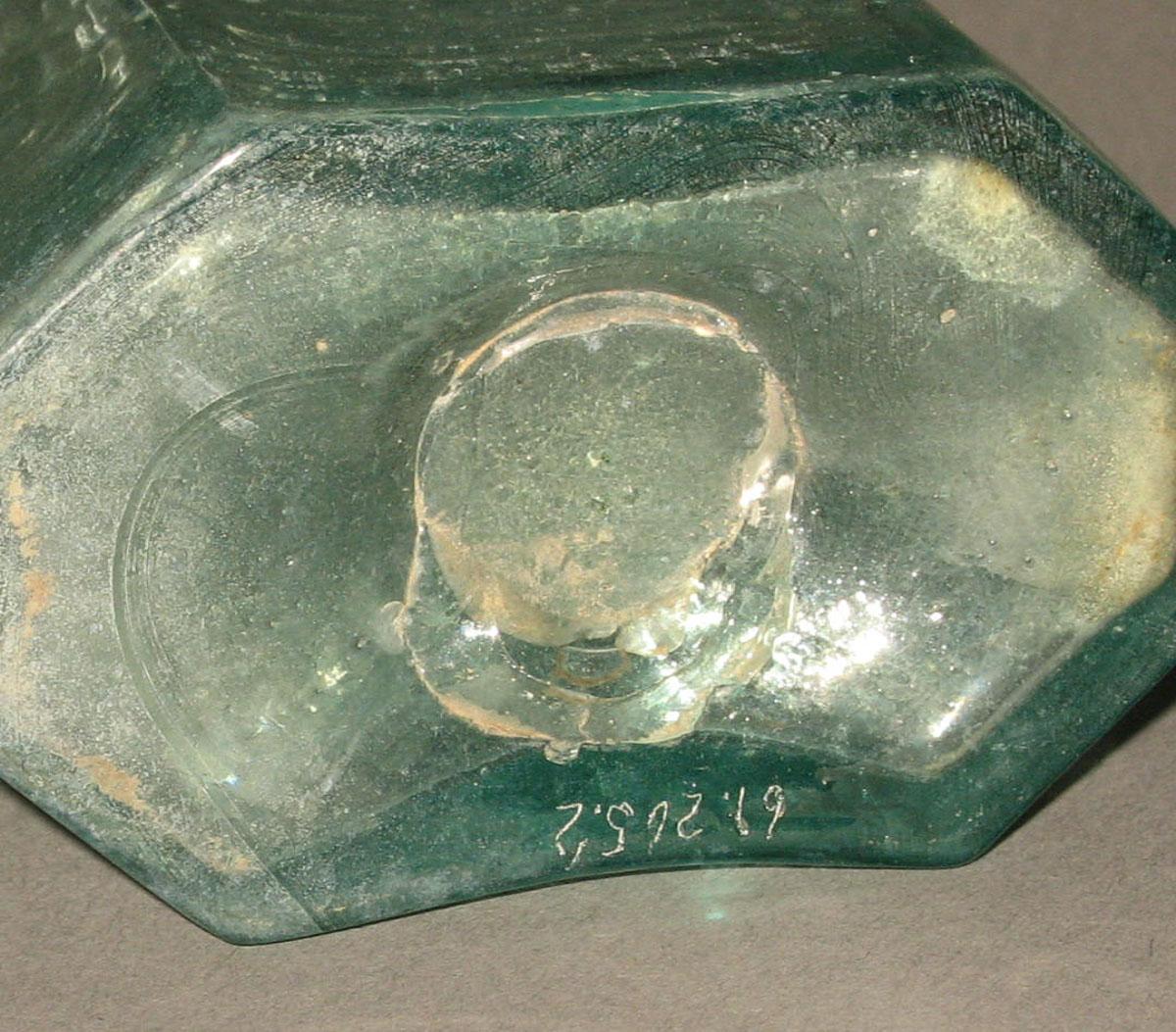 1961.0205.002 Glass syrup bottle (underside)