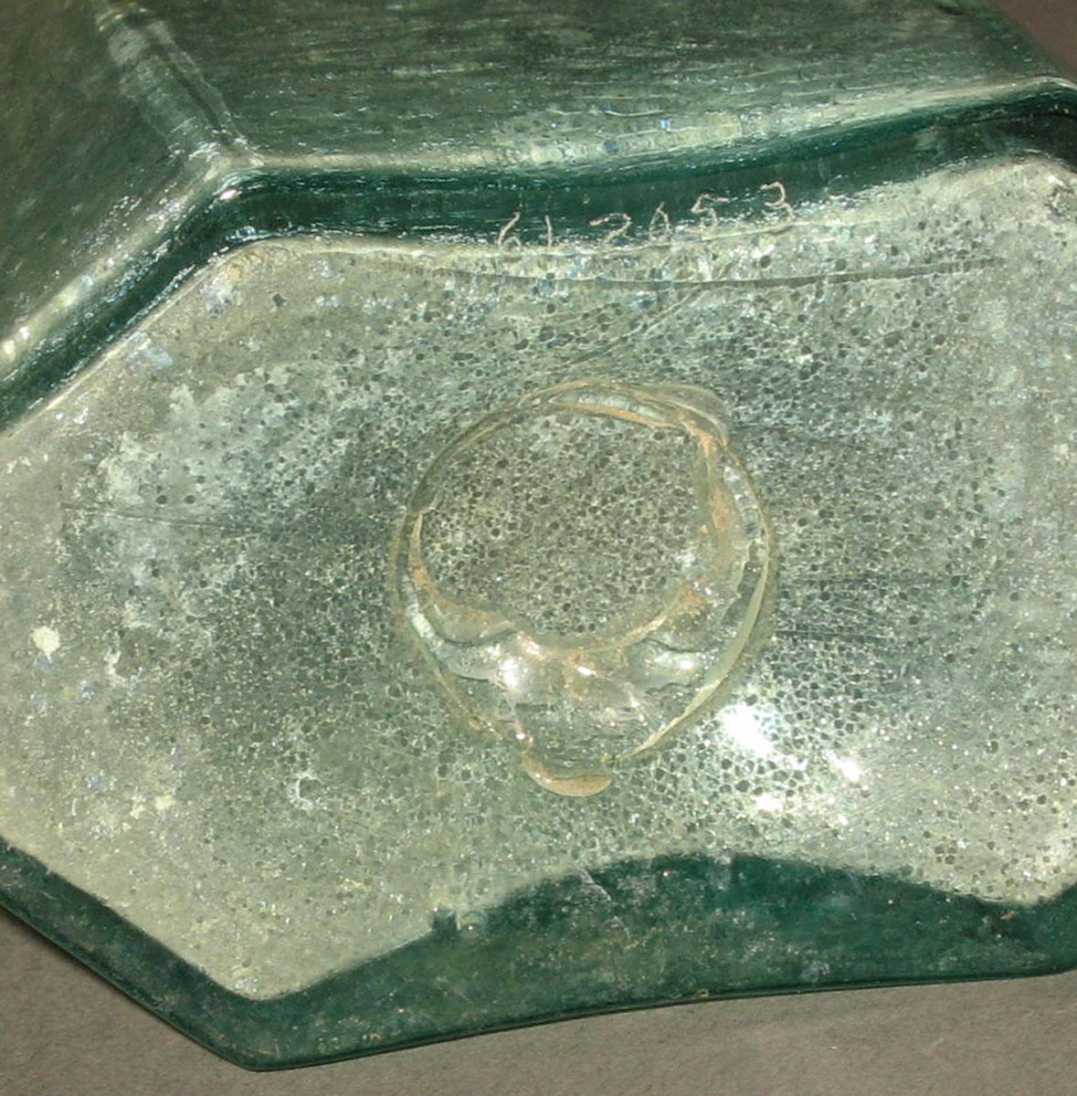 1961.0205.003 Glass syrup bottle (underside)
