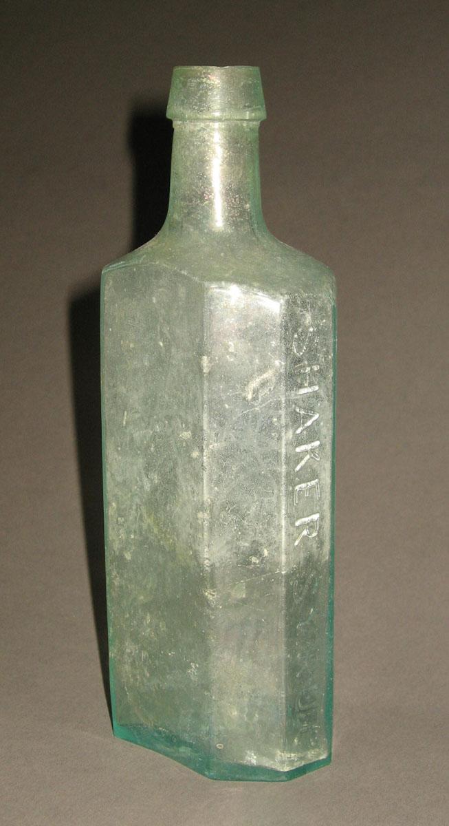 1961.0205.004 Glass syrup bottle (side 1)