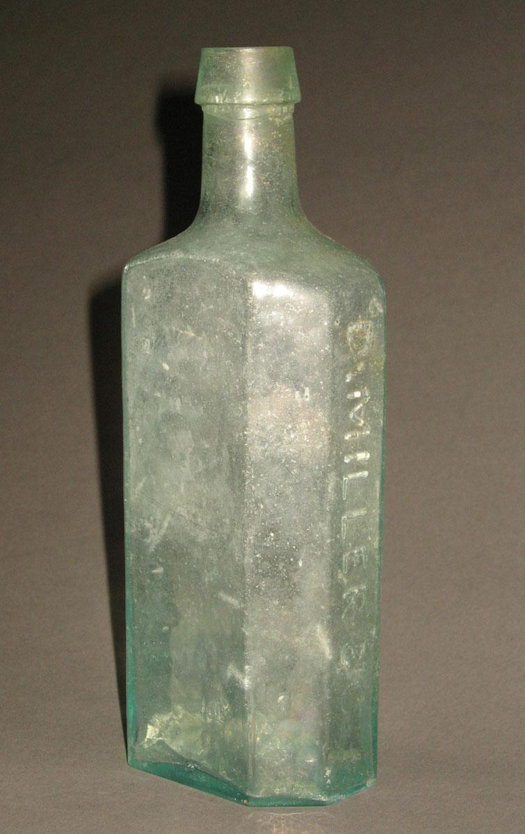 1961.0205.004 Glass syrup bottle (side 2)