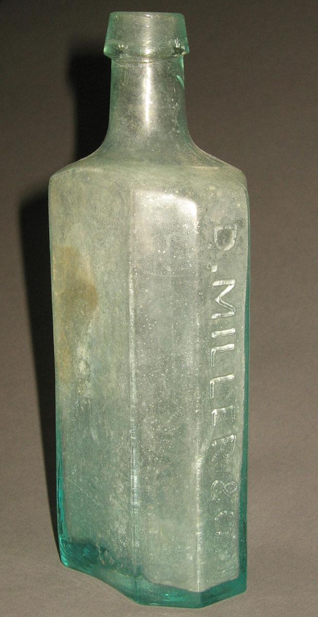 1961.0205.005 Glass syrup bottle (side 2)