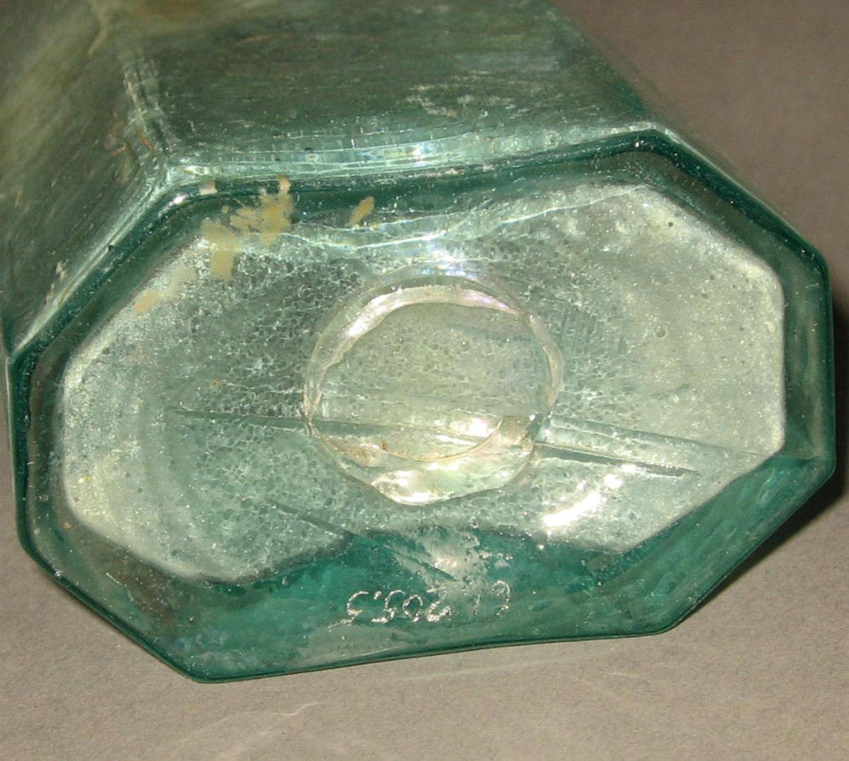 1961.0205.005 Glass syrup bottle (underside)