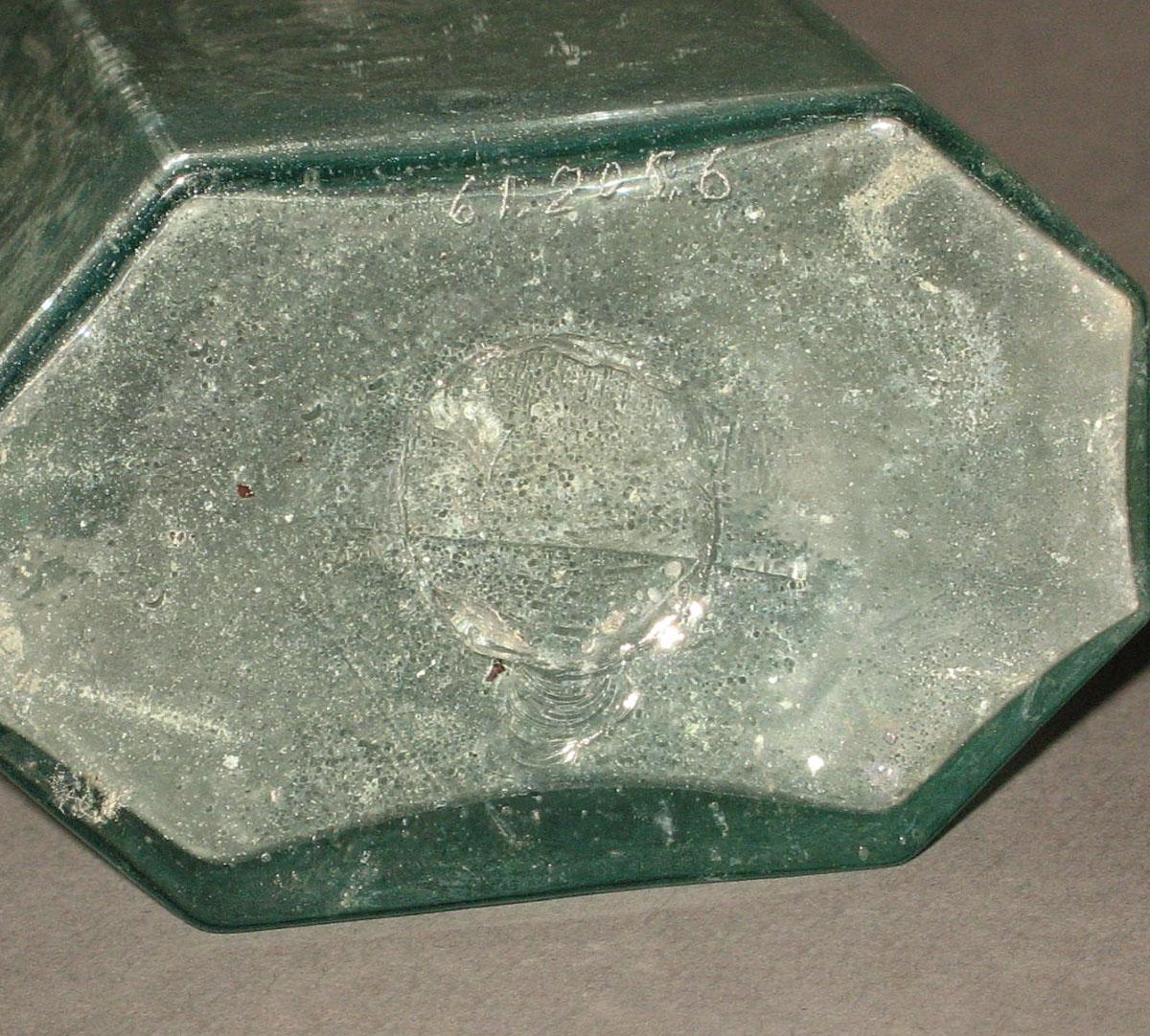 1961.0205.006 Glass syrup bottle (underside)