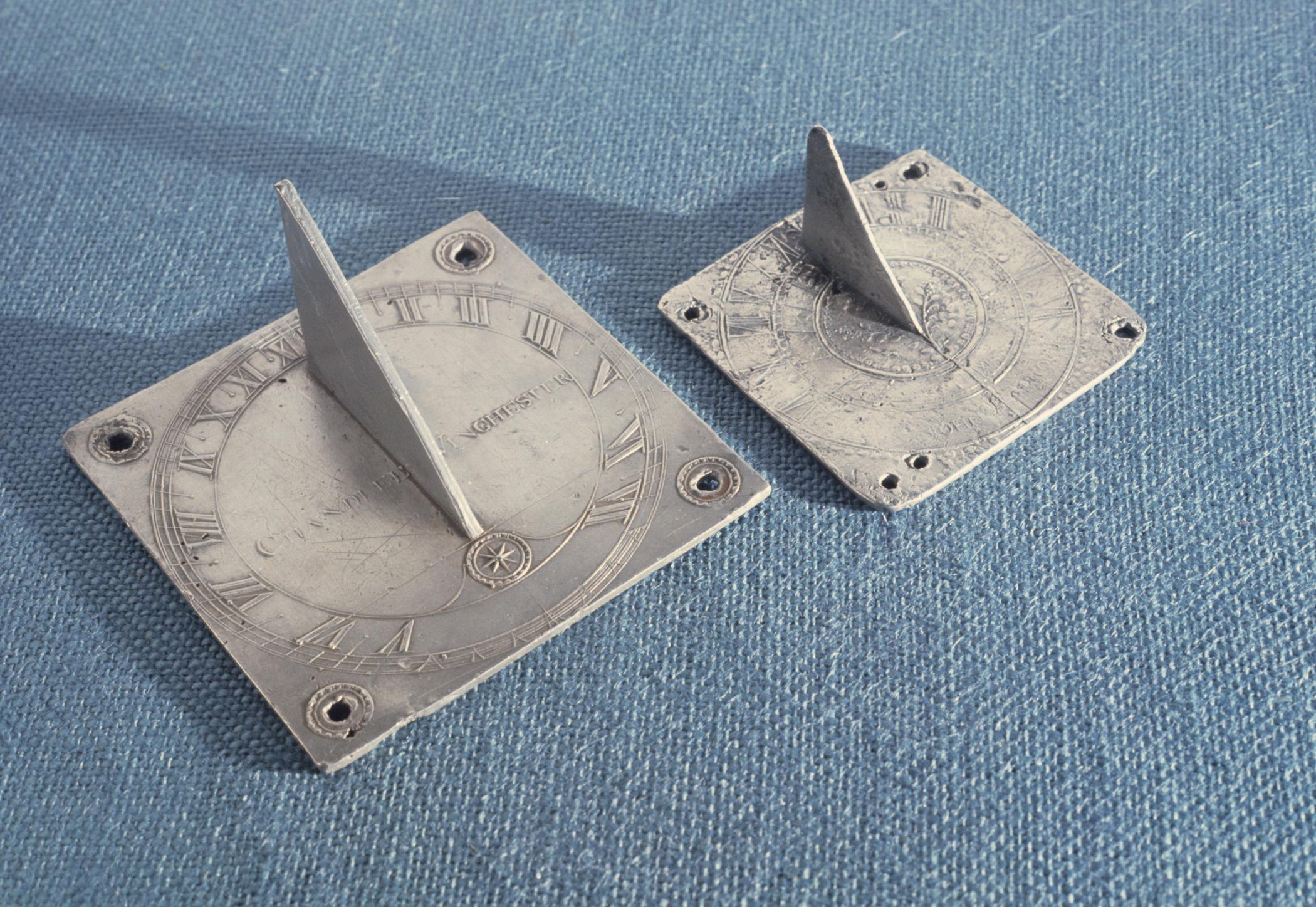 1953.0019 and 1961.0250 Pewter sundials