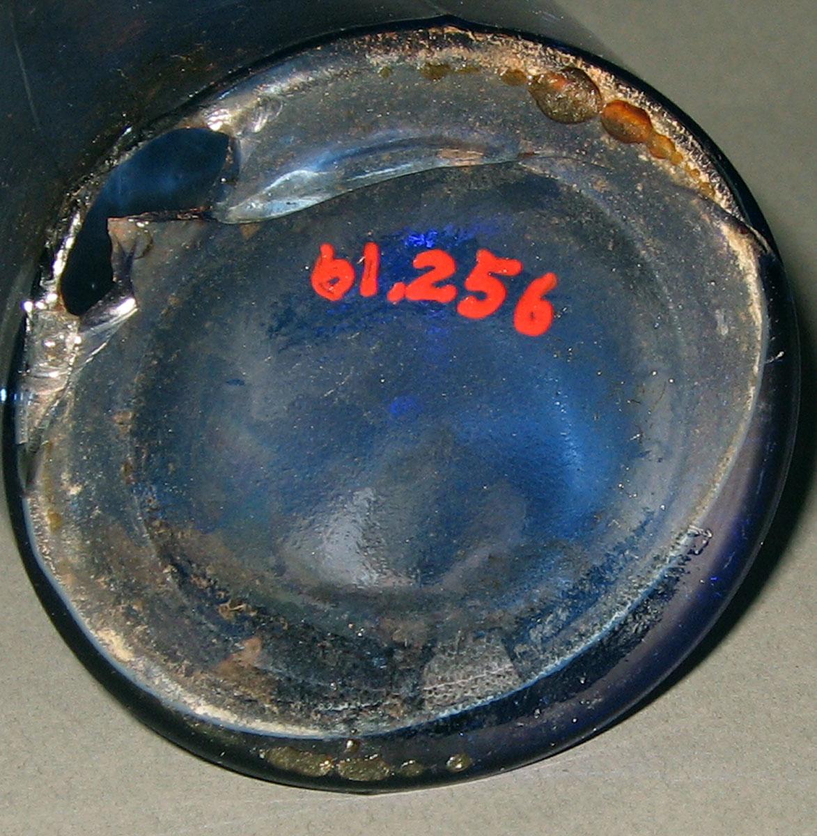 1961.0256 Glass bottle (underside)