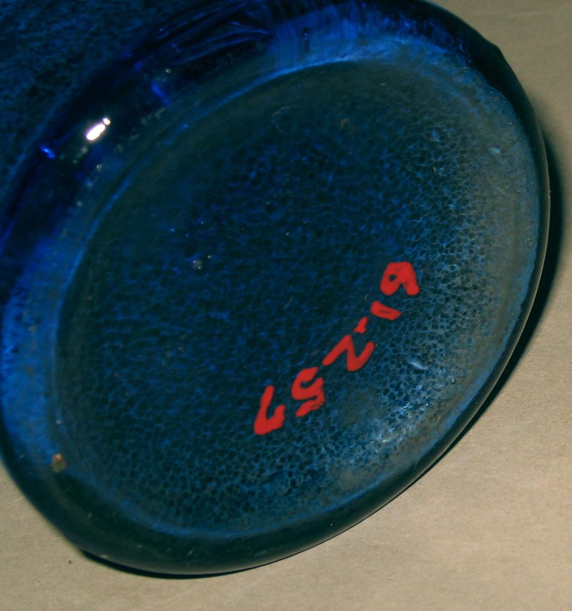 1961.0257 Glass bottle (underside)