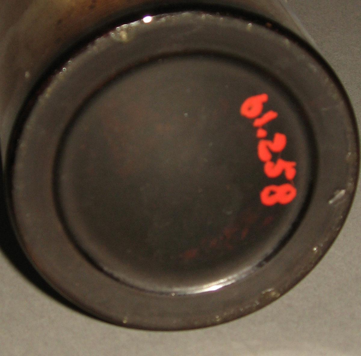 1961.0258 Glass bottle (underside)