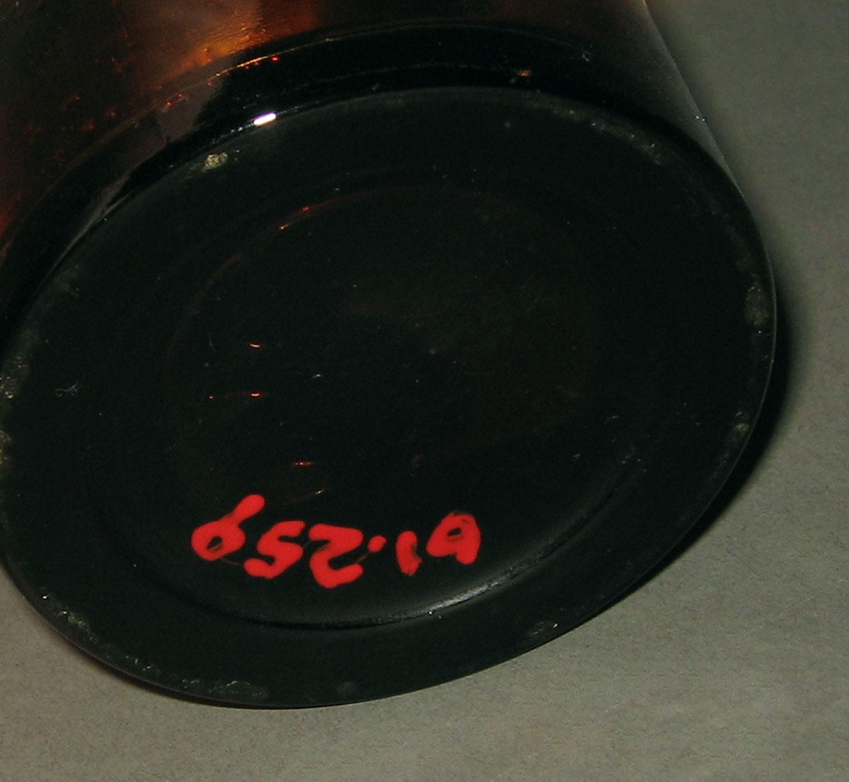 1961.0259 Glass bottle (underside)