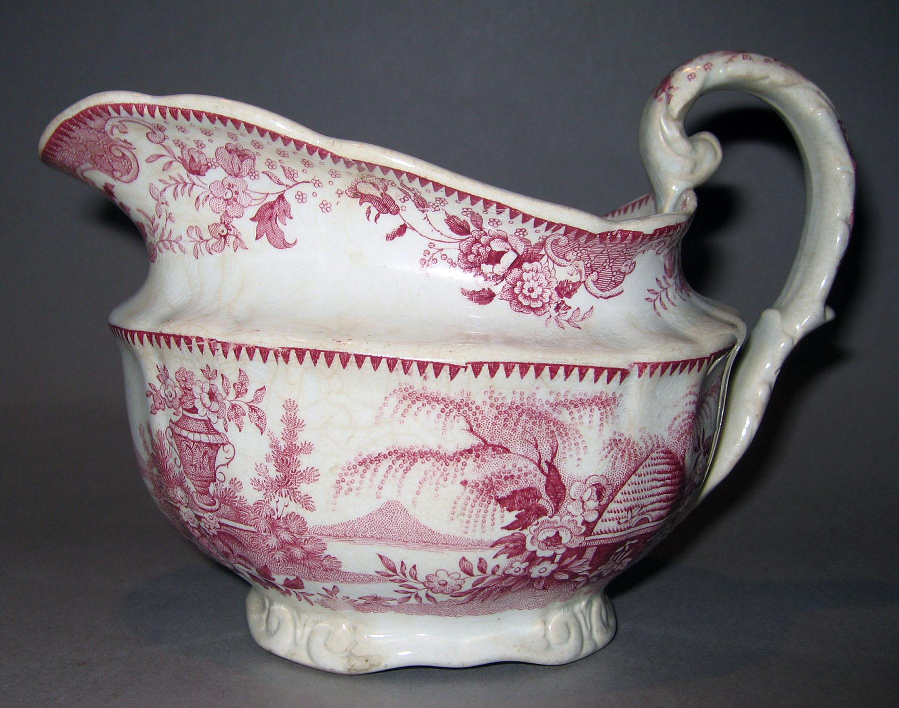 1961.0458 Earthenware cream pot