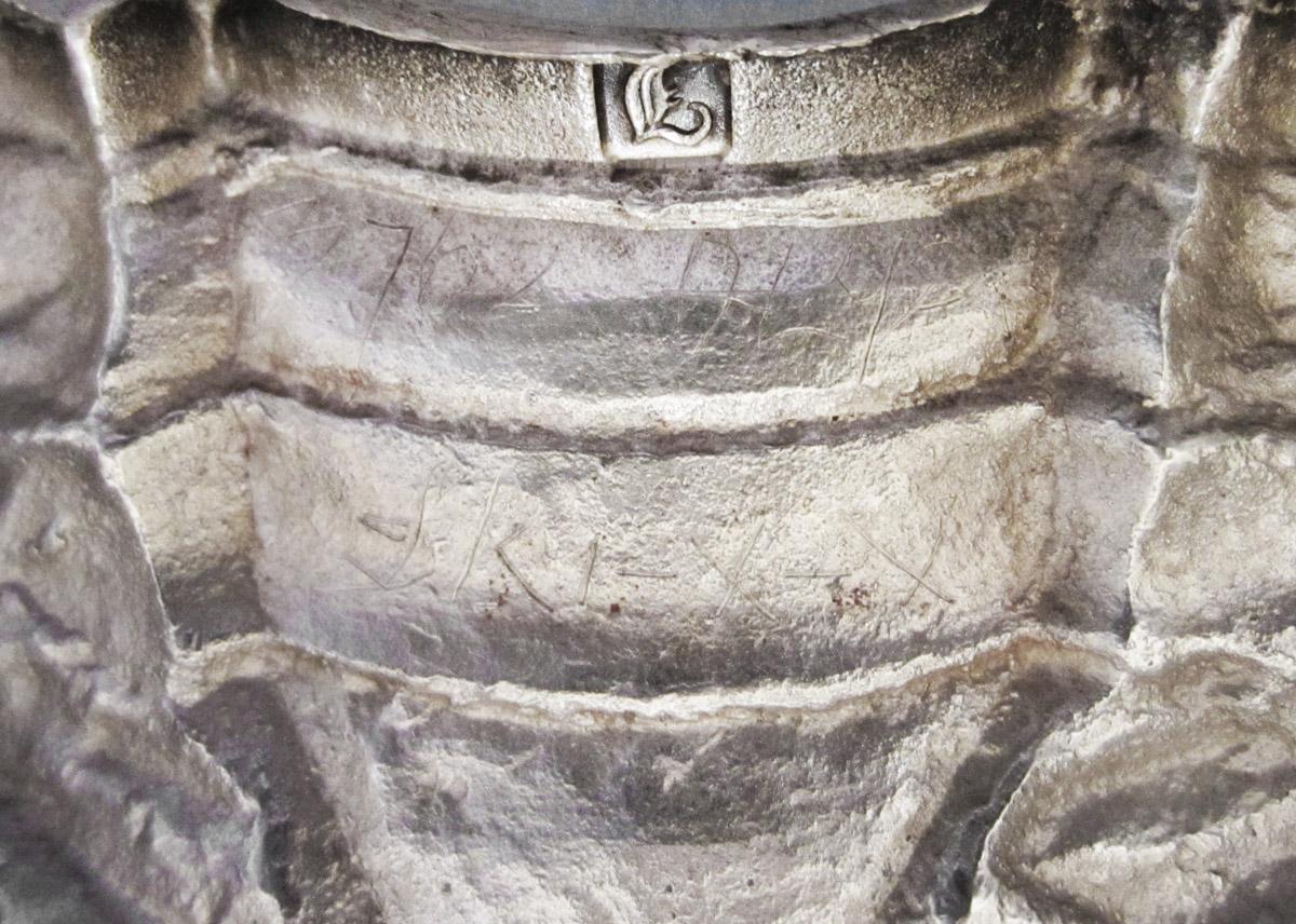 1961.0546.001 A Candlestick, inscription