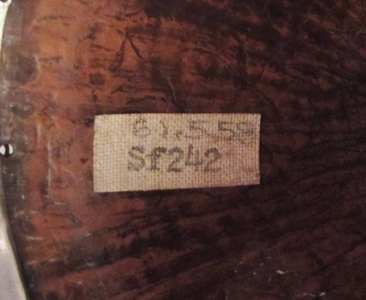 1961.0558 Ladle, label
