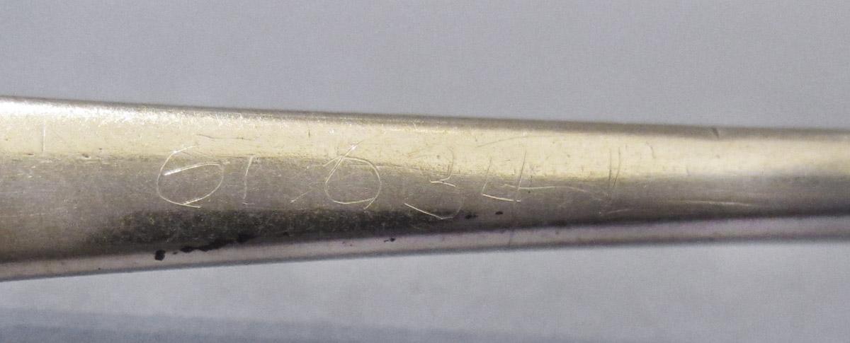 1961.0634.001 Spoon, inscription