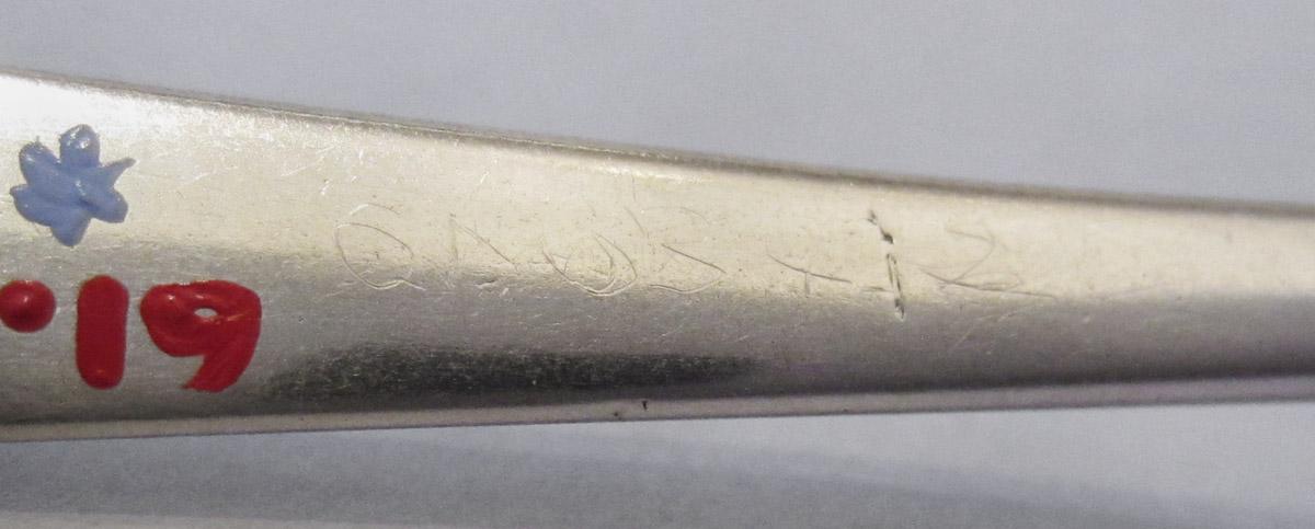 1961.0634.002 Spoon, inscription