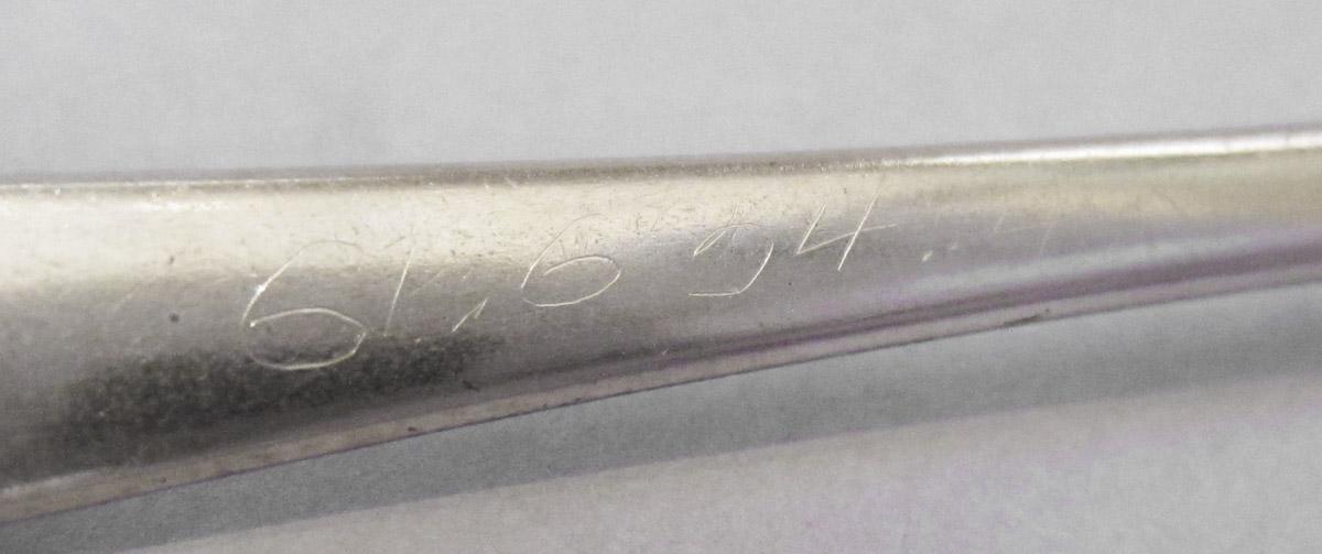 1961.0634.004 Spoon, inscription