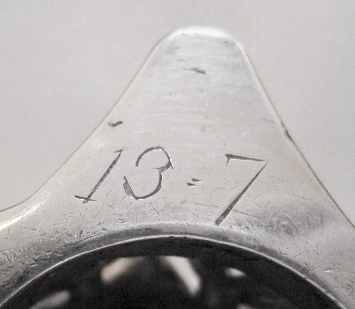 1961.0645.001 A Candlestick, inscription