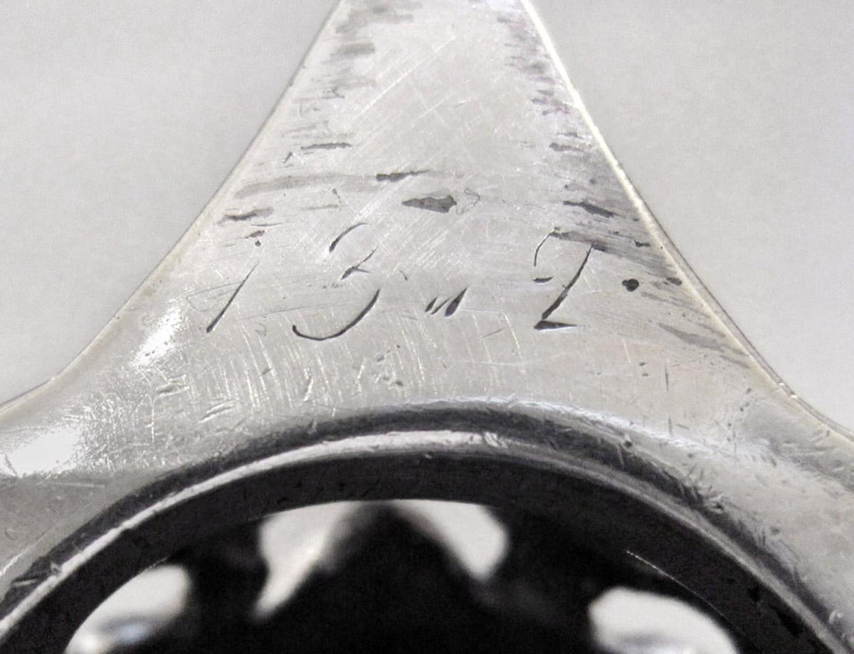 1961.0645.002 A Candlestick, inscription