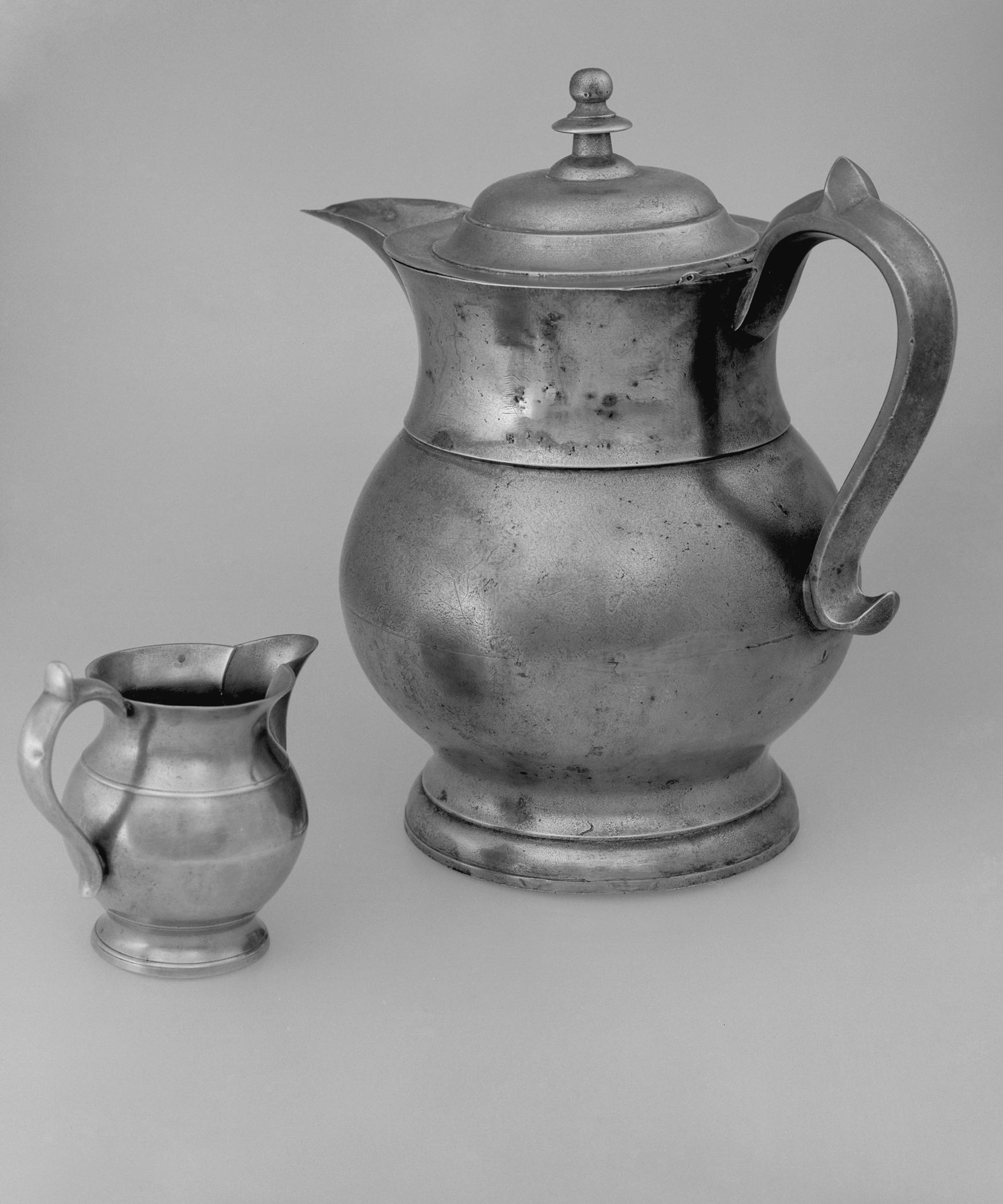 1955.0048.025, 1964.1157 Pewter pitcher and britannia pitcher