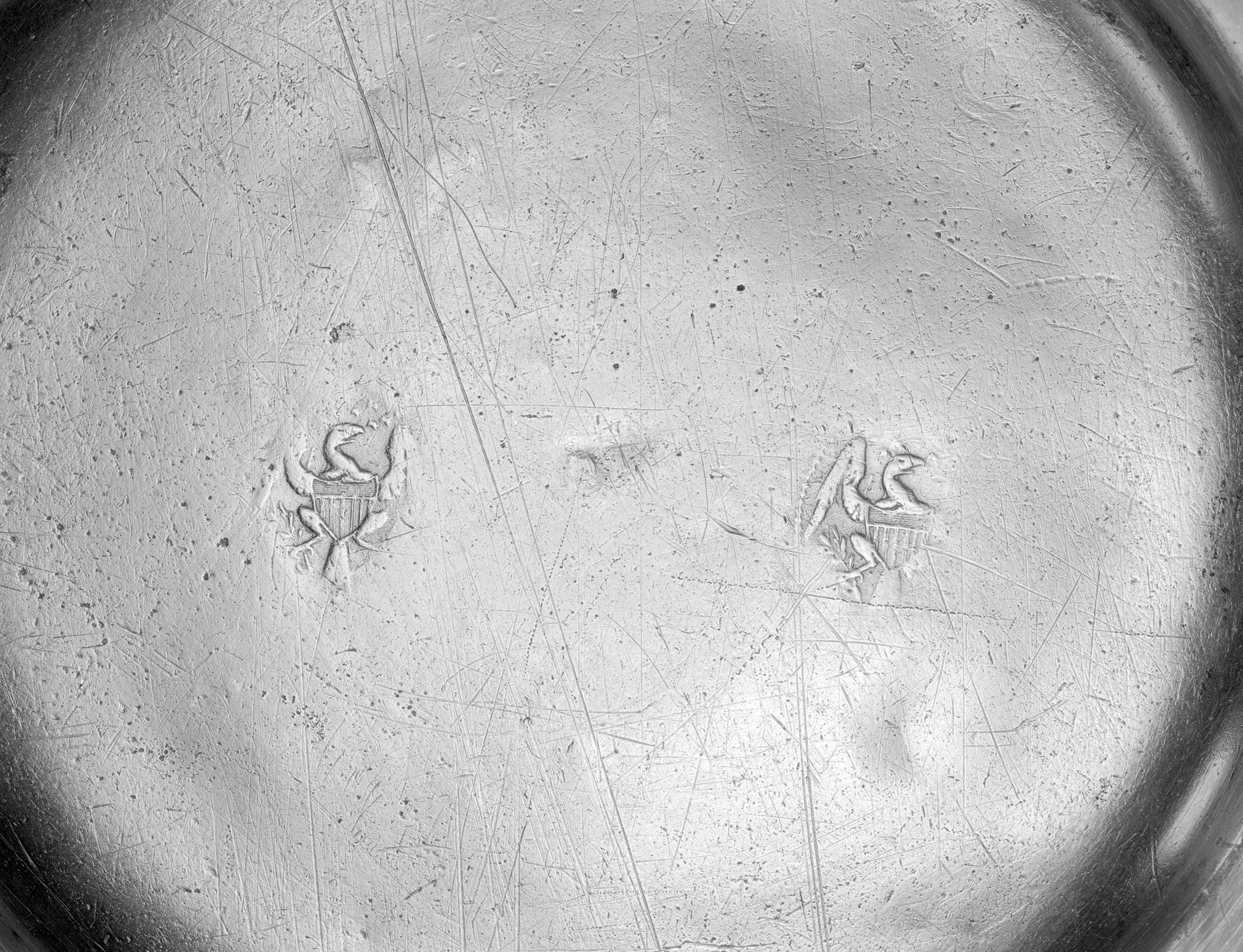 1955.0048.036 Pewter plate (marks)