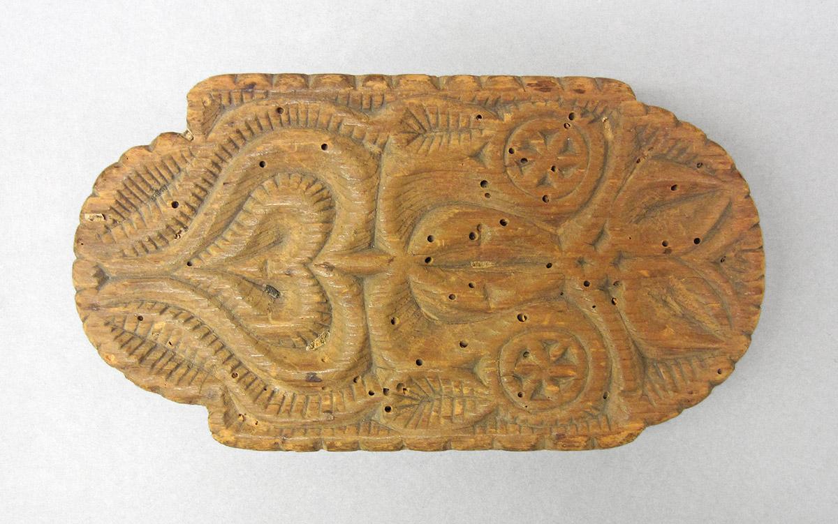 1961.1367, Butter mold, side 1