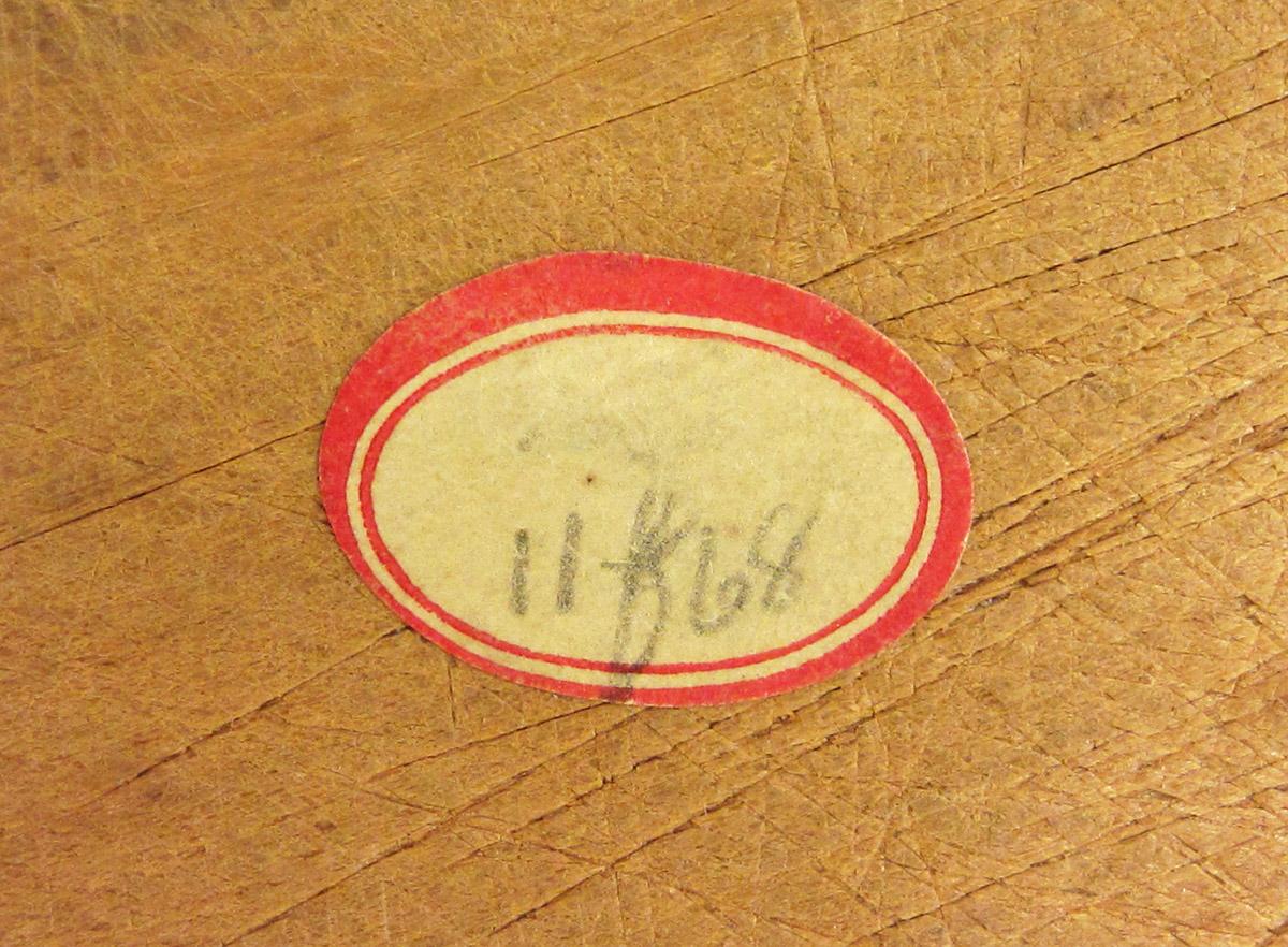 1961.1368, Butter mold, label