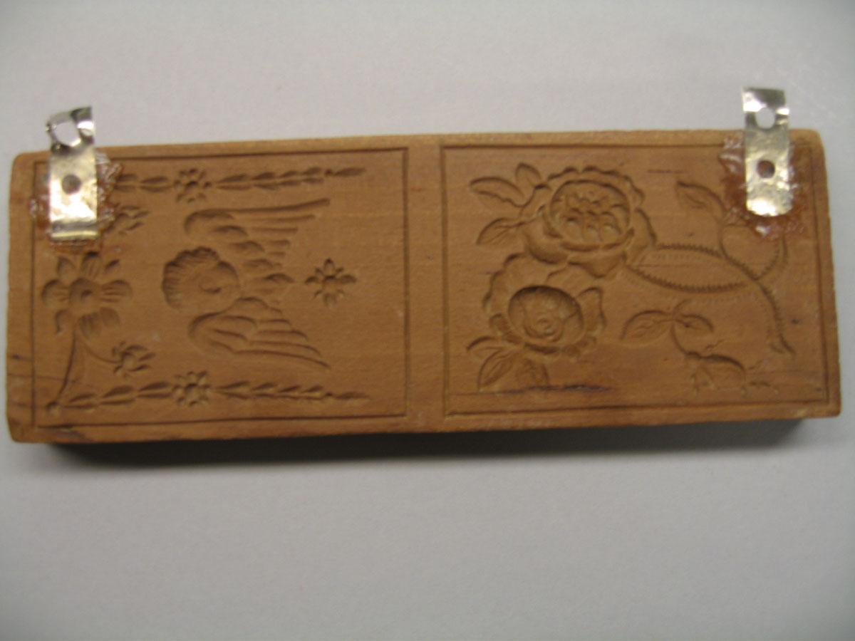 1961.1381 cookie stamp reverse
