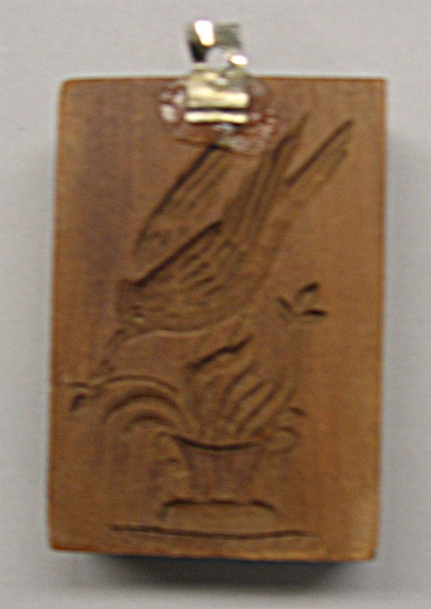 1961.1384 cookie stamp reverse