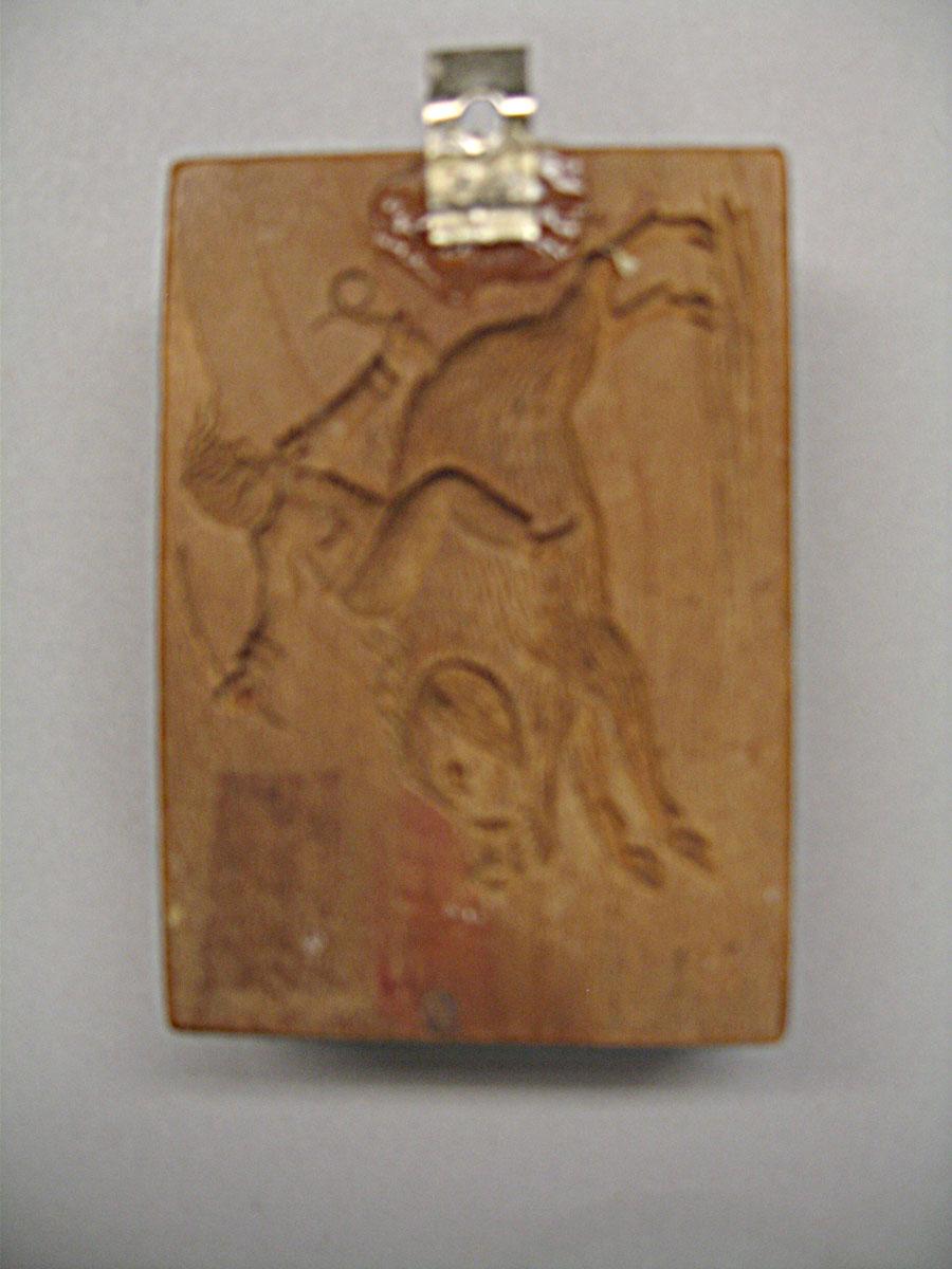 1961.1385 cookie stamp reverse