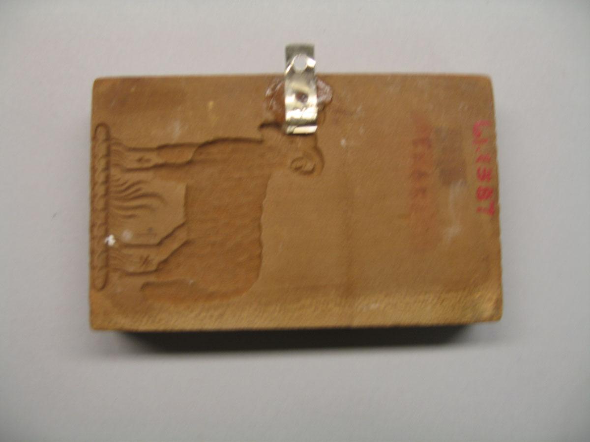 1961.1387 cookie stamp reverse