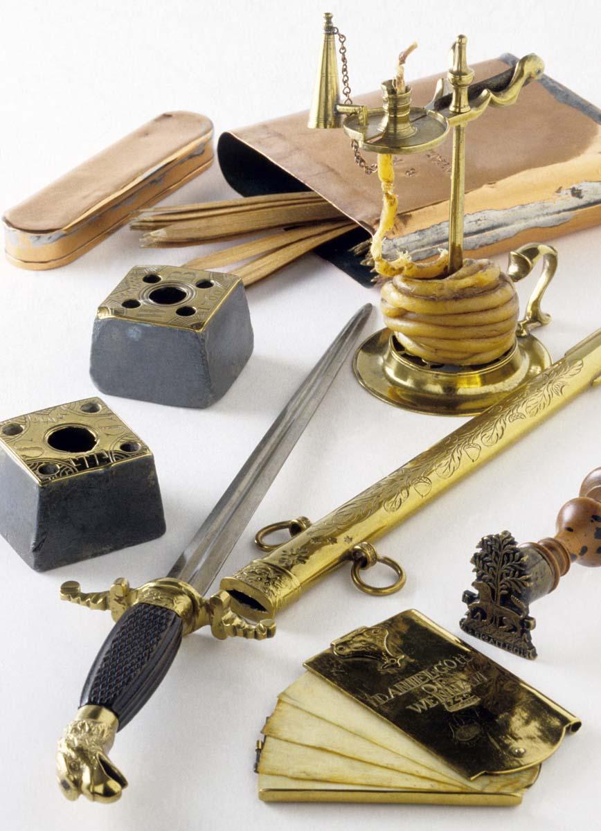 1955.0096.004.002 A, B, 1959.0146, 1952.0127, 1961.1629, 1961.0941, 1964.0088 Dirk, Scabbard, Stamp, Memo Pad, Wax Jack, Taper Stick, Inkwell, view 1
