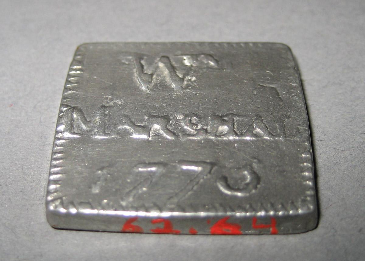 1962.0064 Communion token (reverse)