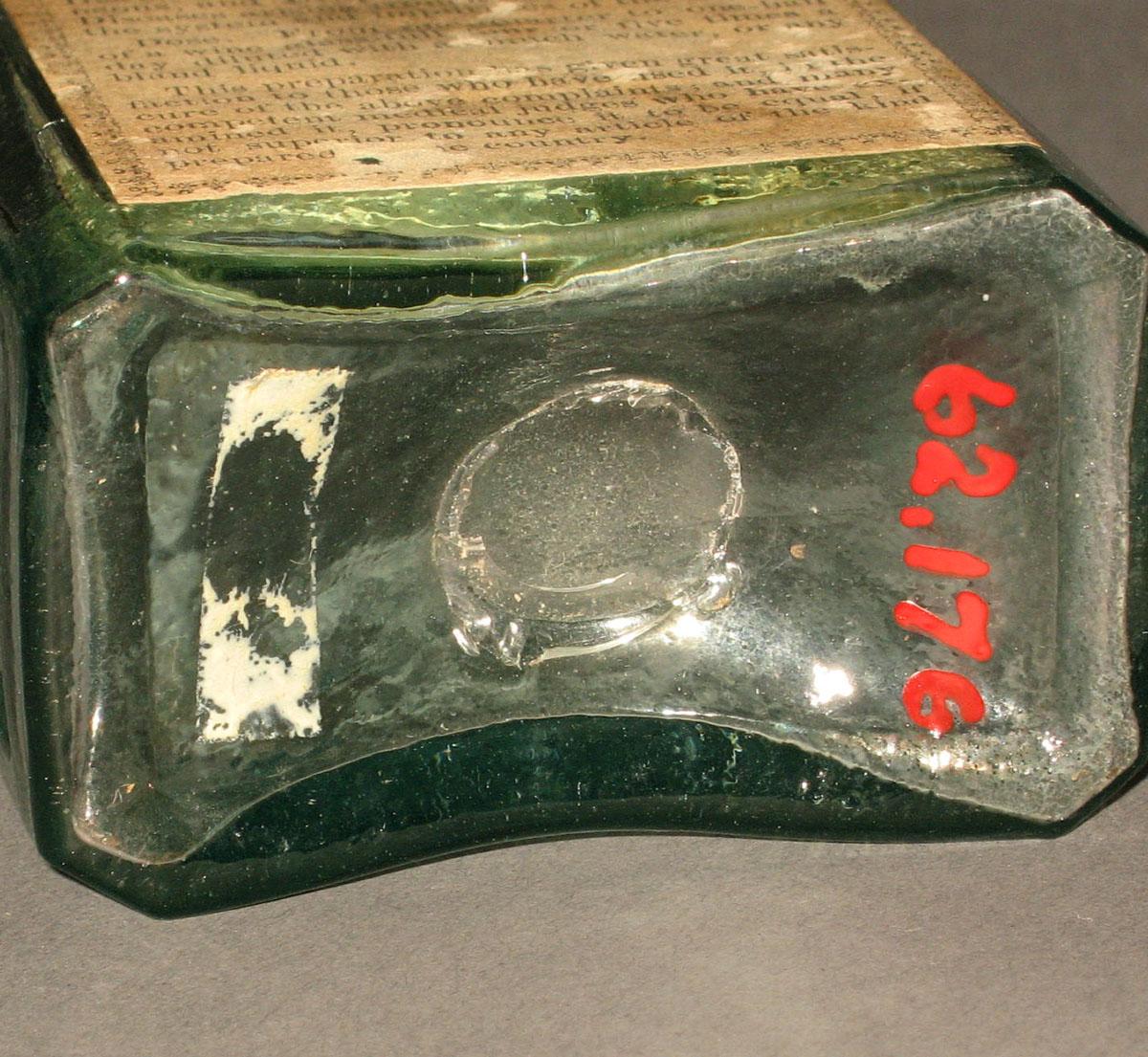 1962.0176 Glass bottle (underside)