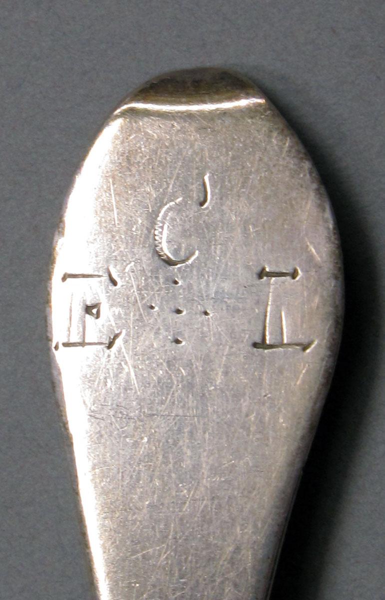 1962.0240.1036 Silver spoon engraving