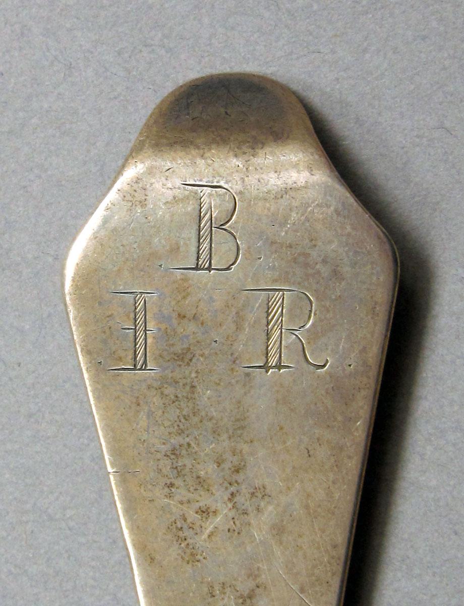 1962.0240.1038 Silver spoon engraving