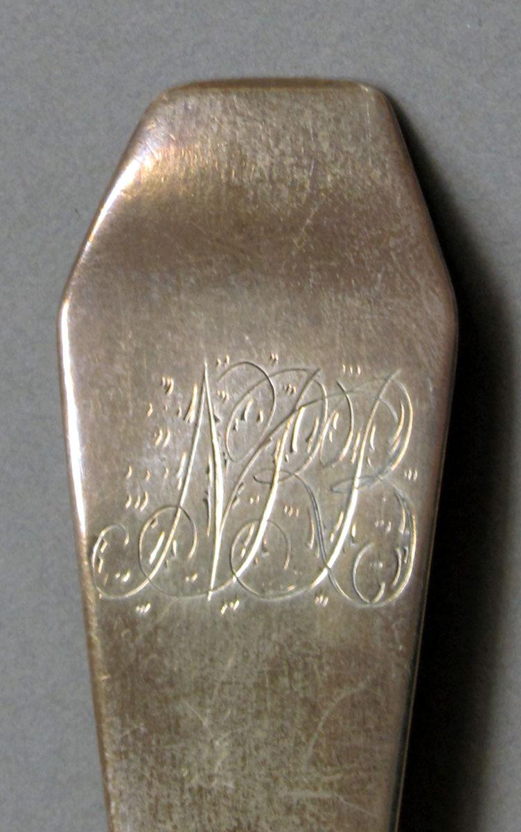 1962.0240.1039 Silver spoon engraving