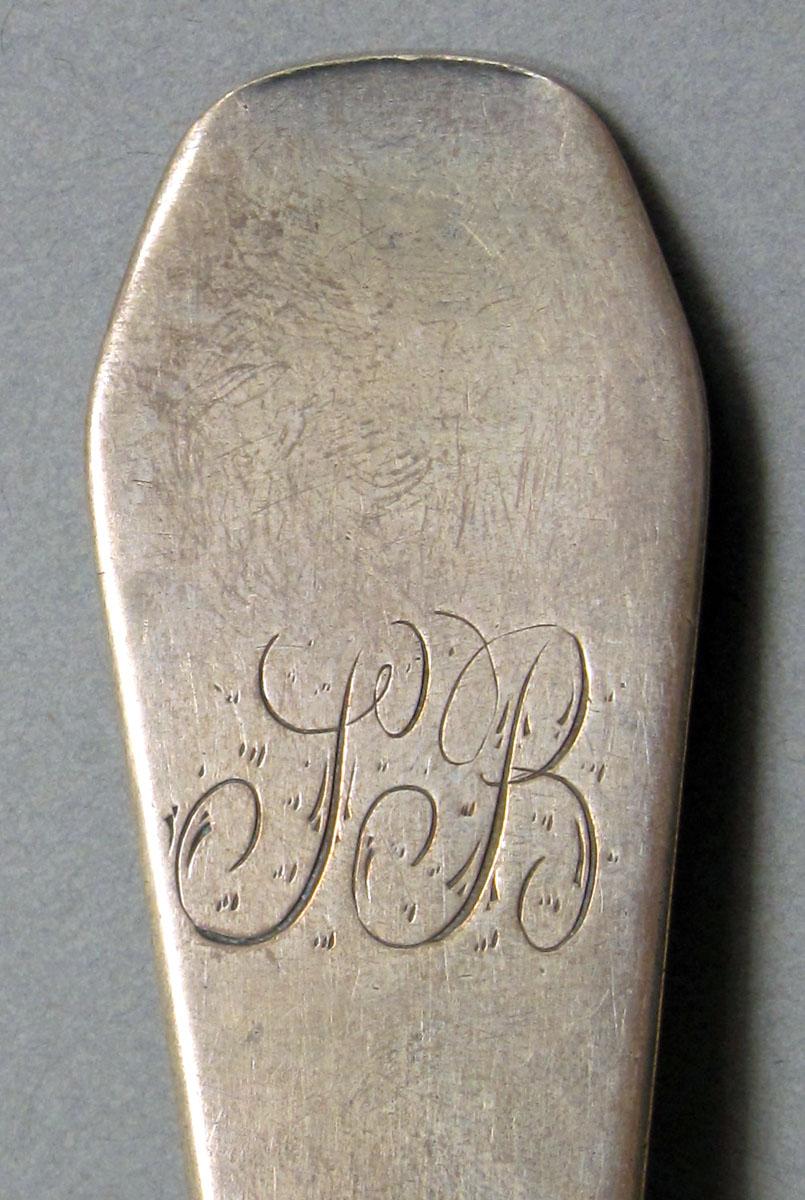 1962.0240.1042 Silver spoon engraving