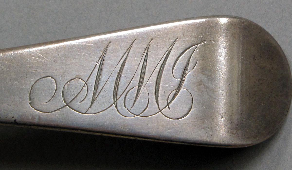 1962.0240.1043 Silver spoon engraving
