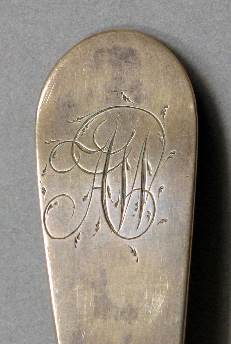 1962.0240.1044 Silver spoon engraving