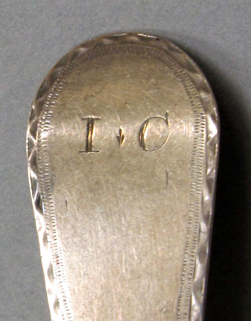 1962.0240.1046 Silver spoon engraving