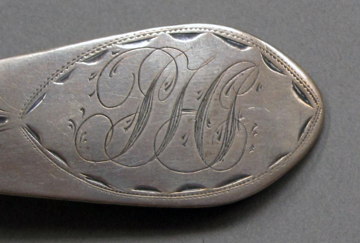 1962.0240.1048 Silver spoon engraving